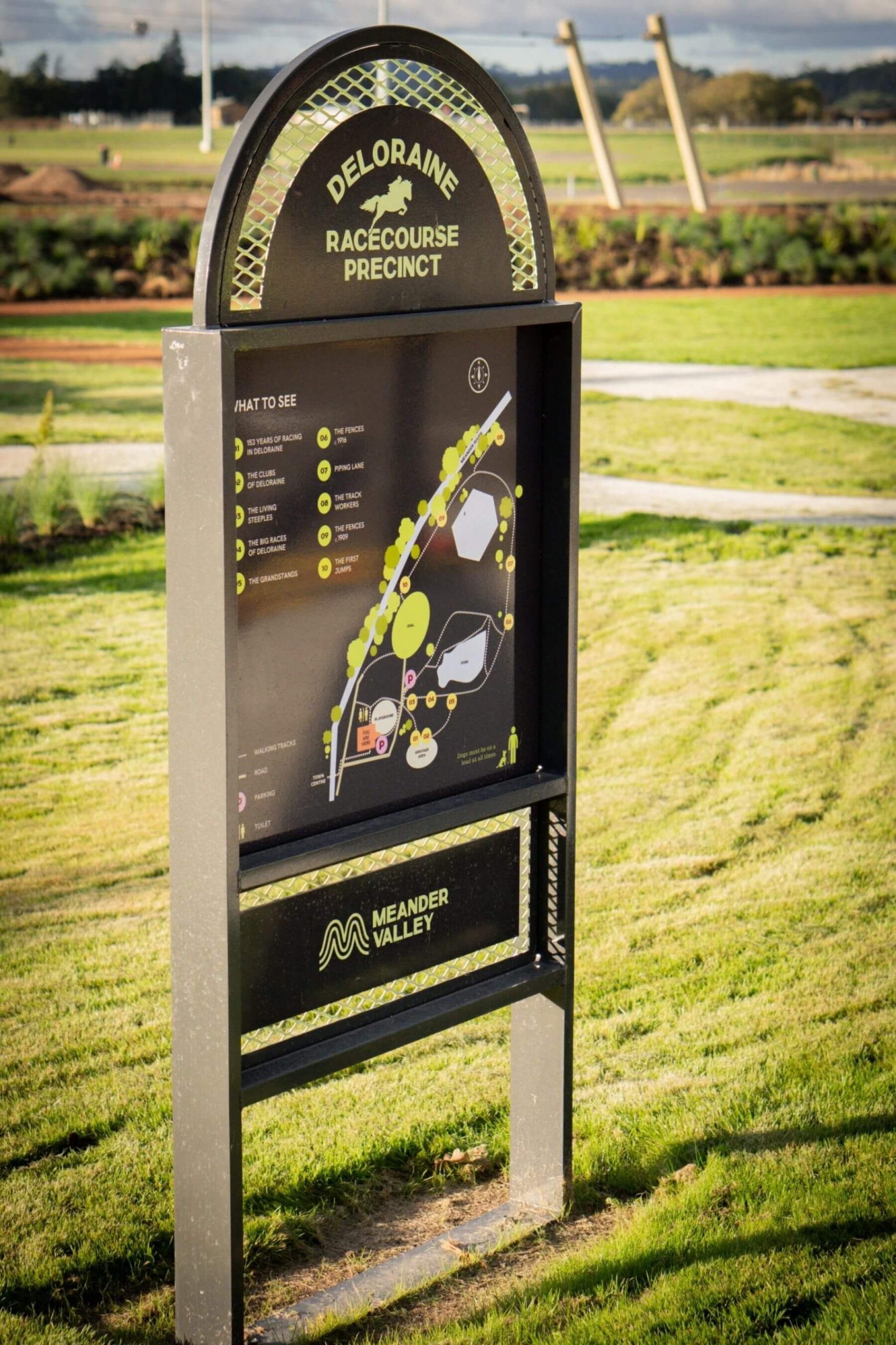 Deloraine Racecourse Recreation Precinct Wayfinding Sign Wayfinding sign at the Deloraine Racecourse Recreation Precinct featuring a site map and heritage information.