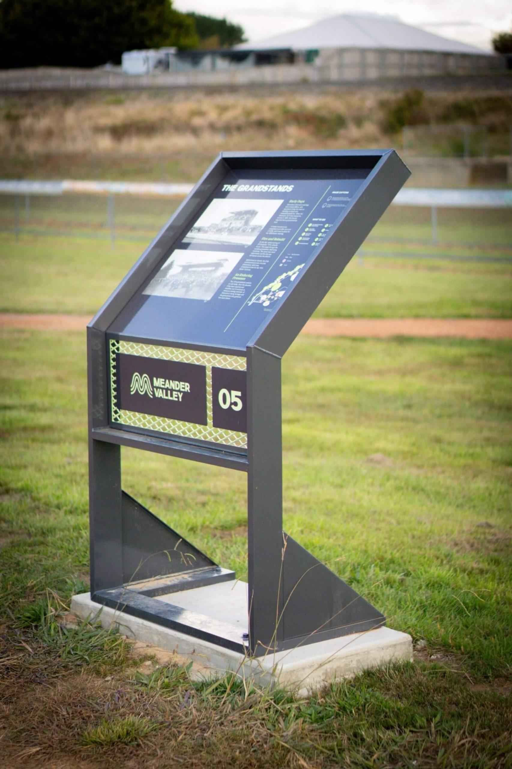 Deloraine Racecourse Recreation Precinct Wayfinding Sign Wayfinding sign at the Deloraine Racecourse Recreation Precinct featuring a site map and heritage information.