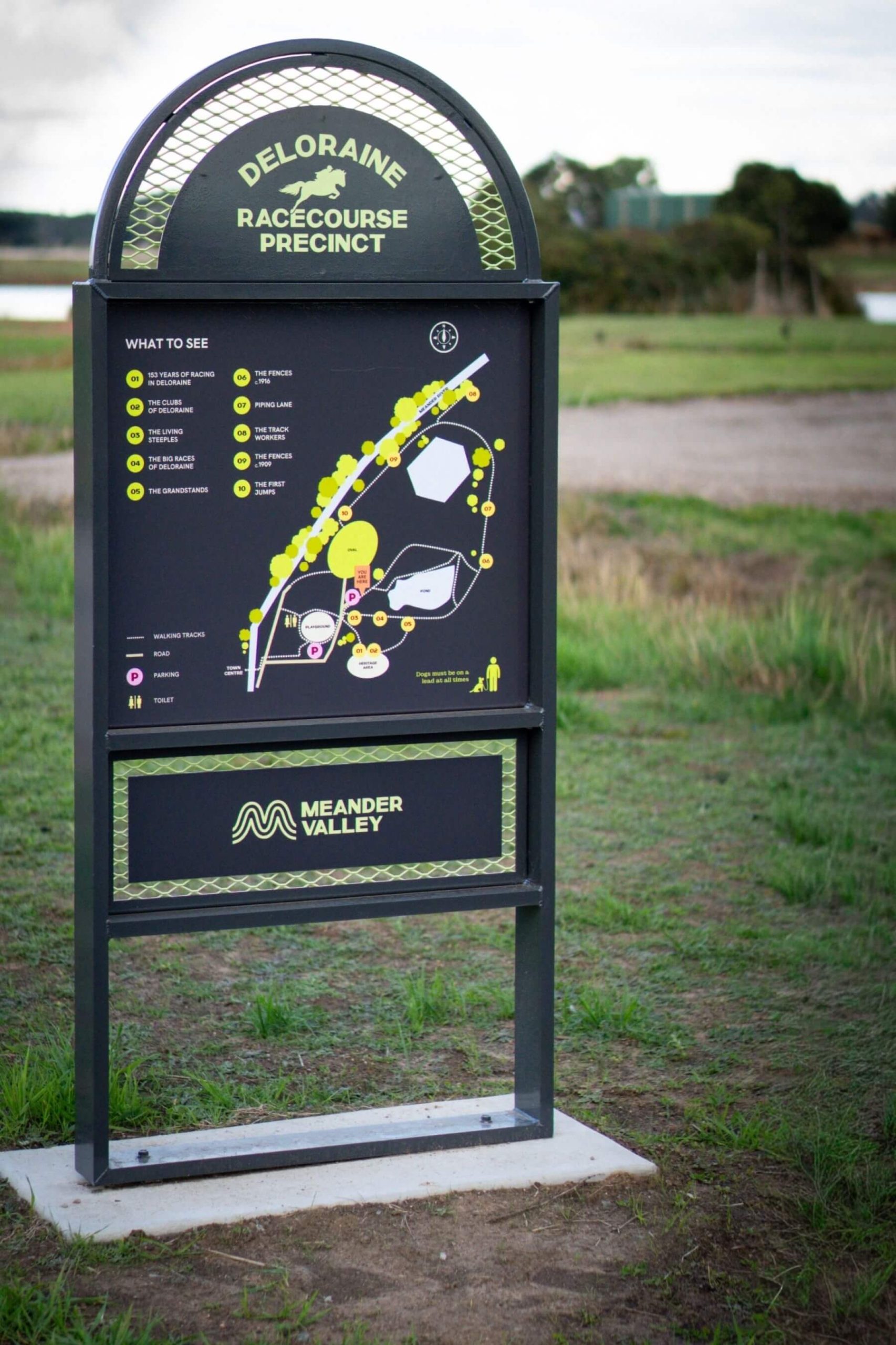 Deloraine Racecourse Recreation Precinct Wayfinding Sign Wayfinding sign at the Deloraine Racecourse Recreation Precinct featuring a site map and heritage information.