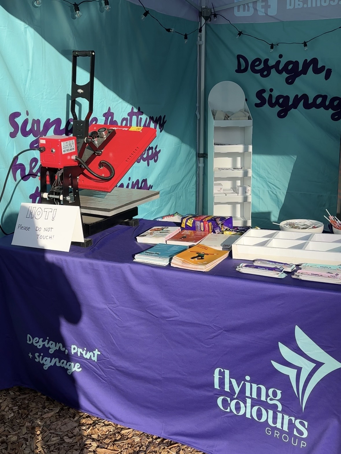 Flying Colours Group print and merchandise display at Agfest