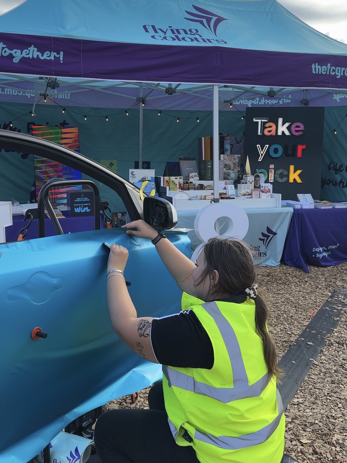 Flying Colours Group vehicle wrap demonstration at Agfest Tasmania