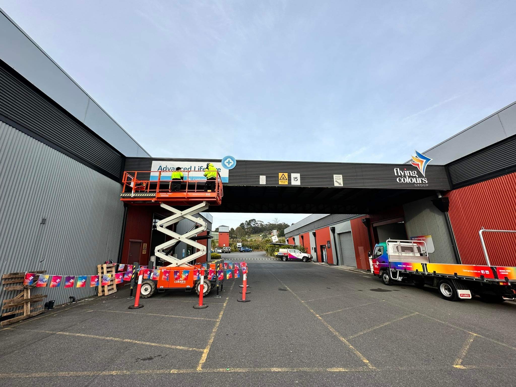 Flying Colours Group installing large-format print signage in Tasmania