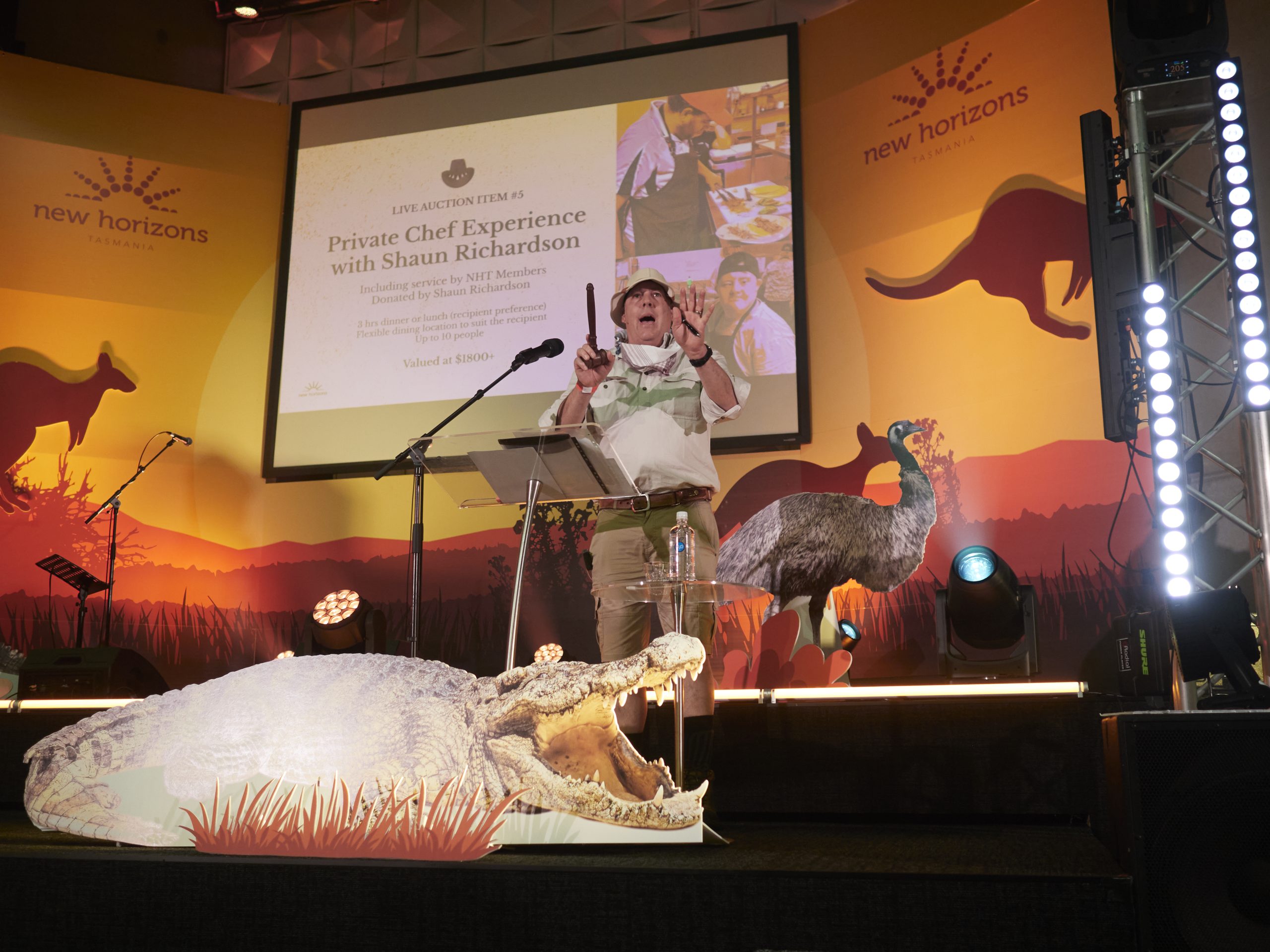 Crocodile Dundee Gala auction with custom crocodile display and stage signage