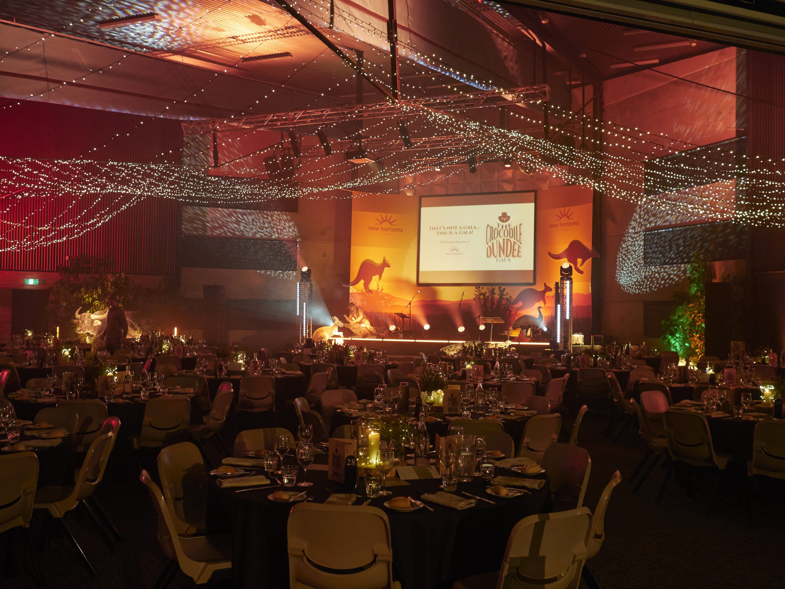 Custom Stage Backdrop and Event Signage Tasmania Crocodile Dundee Gala stage backdrop and event signage by Flying Colours Group Tasmania